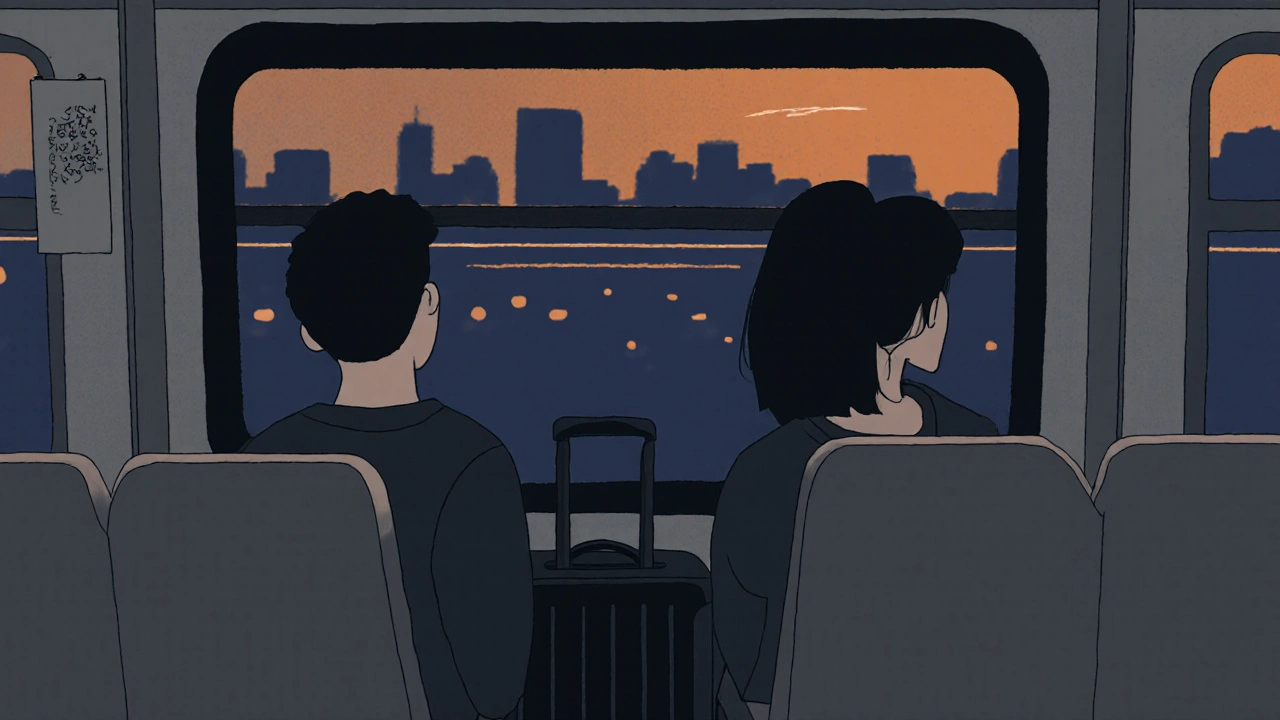 Two young people sit silently on a bus, staring out the window as city lights blur behind them.